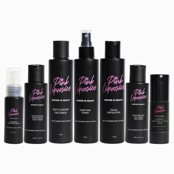 Seven stylish black bottles of skincare products