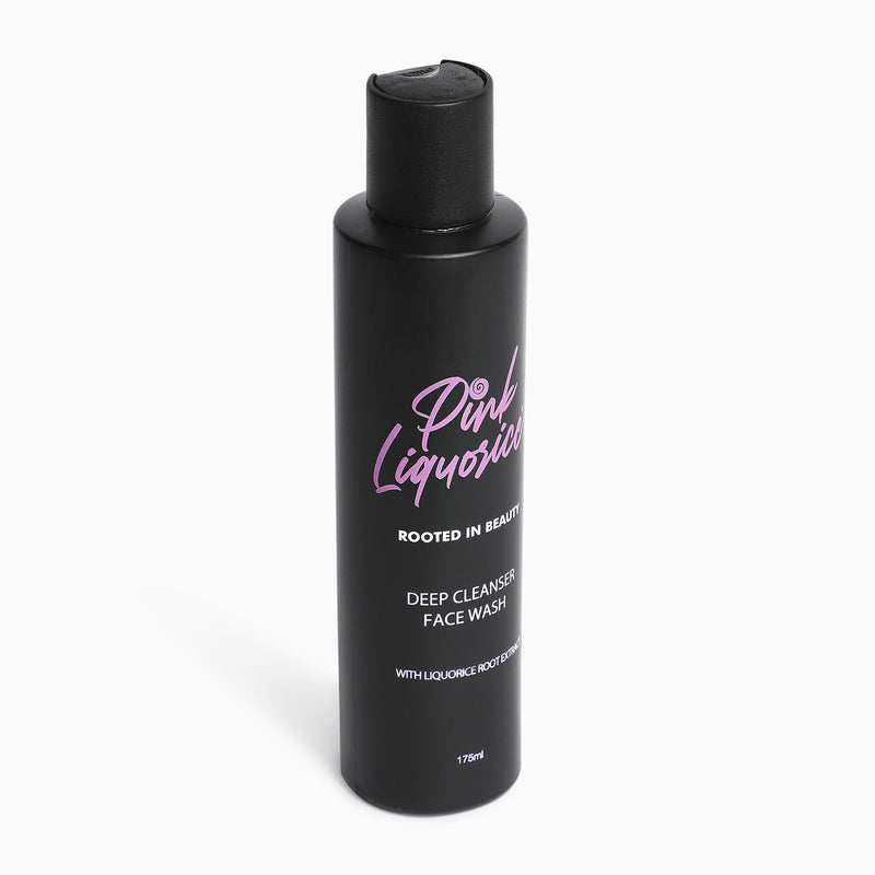 Side view of black bottle of facial cleanser with liquorice root extract