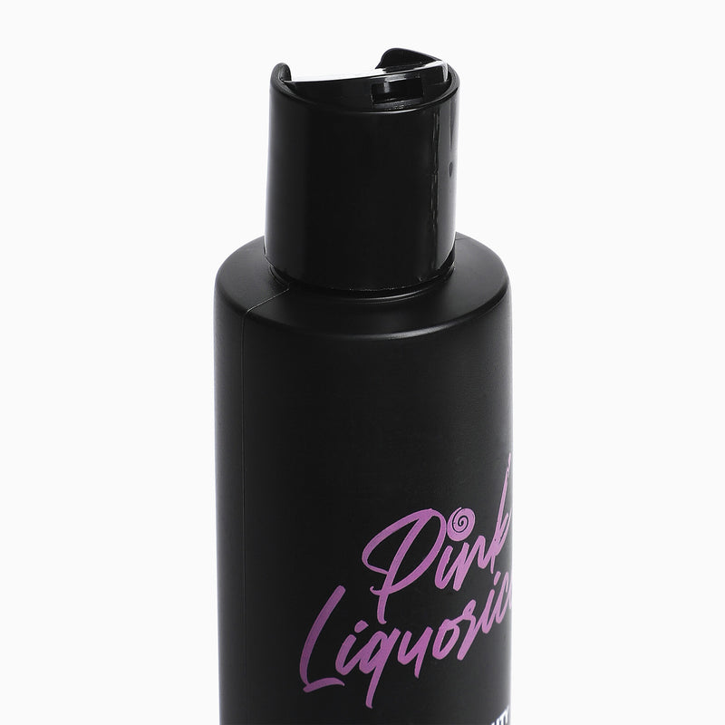 Close up of a black skincare bottle by Pink Liquorice