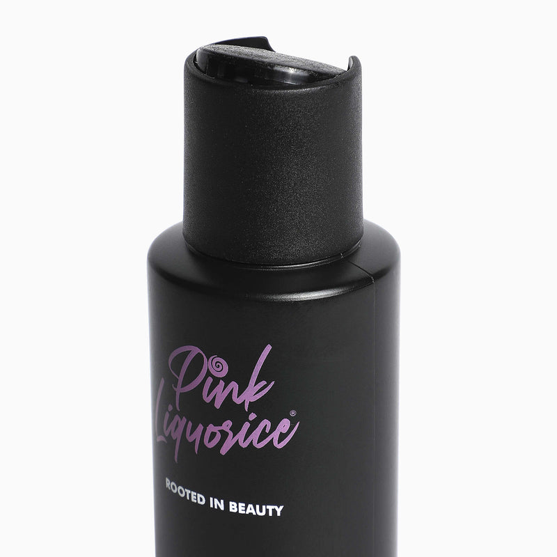Close up of black skincare bottle by Pink Liquorice